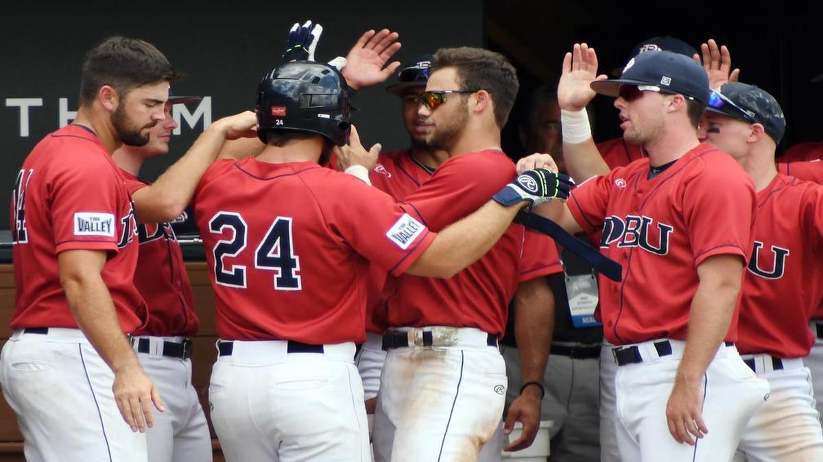 Dallas Baptist hitter Austin Listi (24) gets congratulations from teammates after his second home run of the game, in the fifth inning for a 5-3 lead against Central Connecticut State at the Fort Worth Regional.