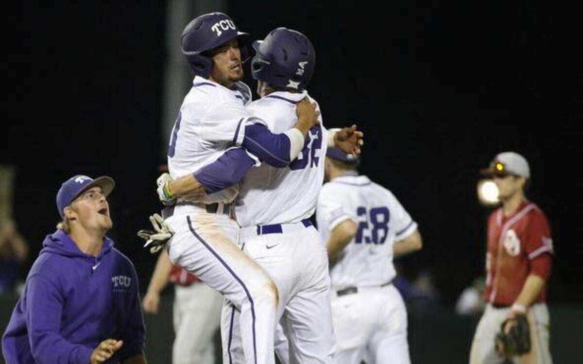 
Dane Steinhagen, left, and Jeremie Fagnan embrace after Fagnan’s game-winning hit in the 10th.


