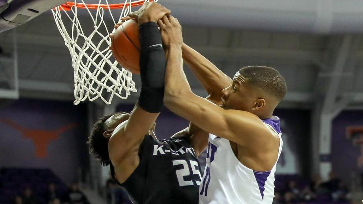 TCU senior Brandon Parrish, right, fighting for a rebound Wednesday against Kansas State’s Wesley Iwundu, said the young Horned Frogs are struggling through a learning curve.