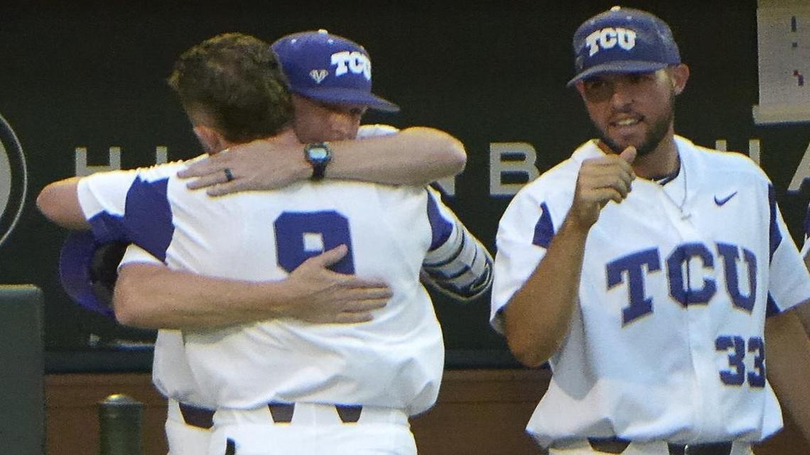 TCU catcher Evan Skoug gets a congratulatory embrace from coach Jim Schlossnagle after a grand slam in the sixth inning against UT Arlington on Tuesday at Lupton Stadium. Teammate Mitchell Traver looks on.