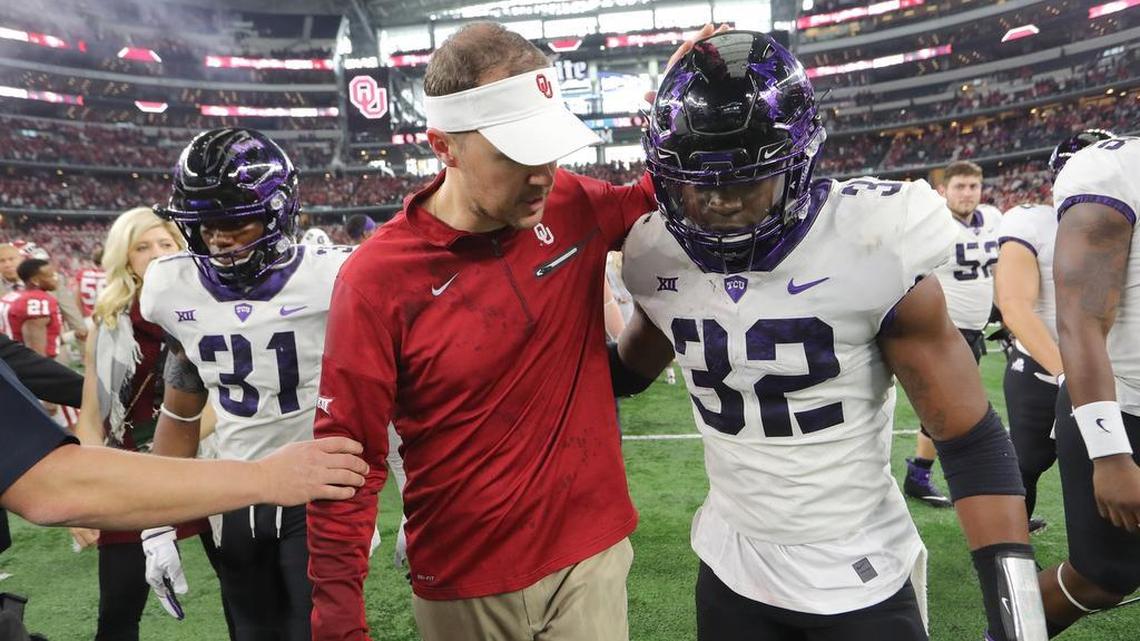 Oklahoma coach Lincoln Riley and TCU linebacker Travin Howard share a word after the Big 12 championship game Dec. 2 at AT&T Stadium. Howard was a 2014 signee of TCU, when he was a three-star recruit.
