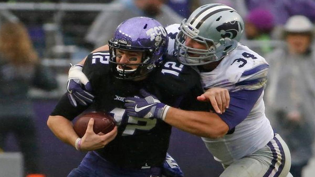 TCU quarterback Foster Sawyer, left, made his first start of the season but his production was limited thanks to the play of Kansas State defenders such as defensive end Tanner Wood.