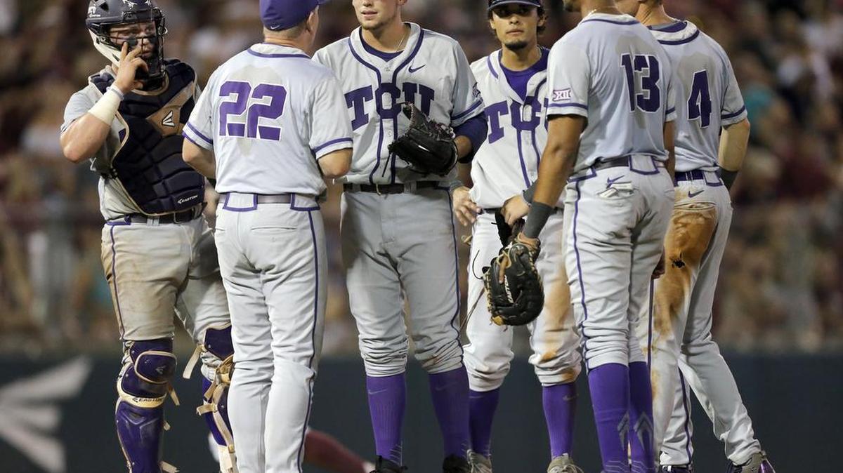 TCU coach Jim Schlossnagle talks with pitcher Jared Janczak and the infielders during the eighth inning of Game 1 of a Super Regional series at Texas A&M on Friday night. TCU won 8-2, then Texas A&M countered with a 7-1 victory Saturday night to force a deciding Game 3 on Sunday night. It is the second consecutive Game 3 between the two teams and the third straight for TCU.