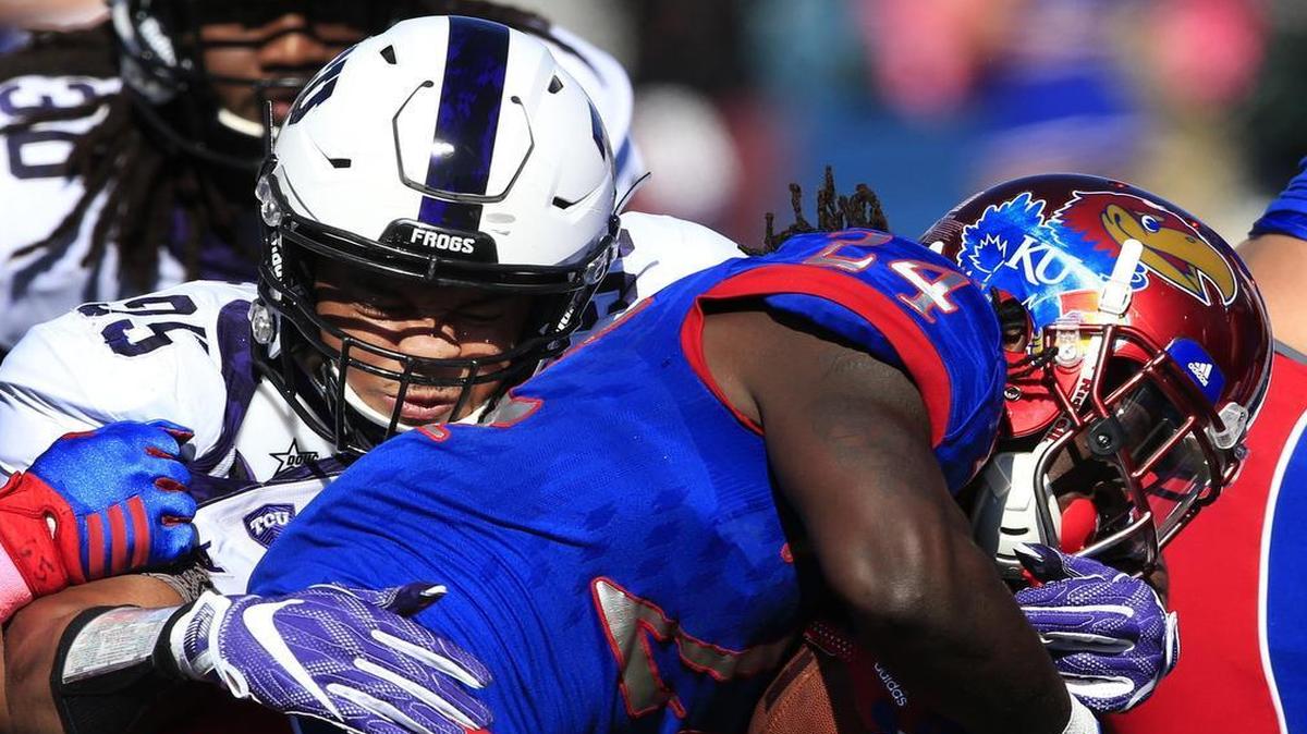 TCU defensive tackle Aaron Curry makes a tackle against Kansas running back Taylor Martin in last week’s game at Lawrence. Curry had one of the Horned Frogs’ five sacks and is second on the team with 3.5.