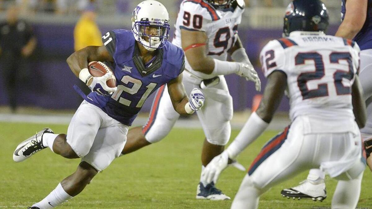 
TCU running back Kyle Hicks moves upfield against Stamford in the season opener last year. He is one of four backs the Horned Frogs plan to use this season.

