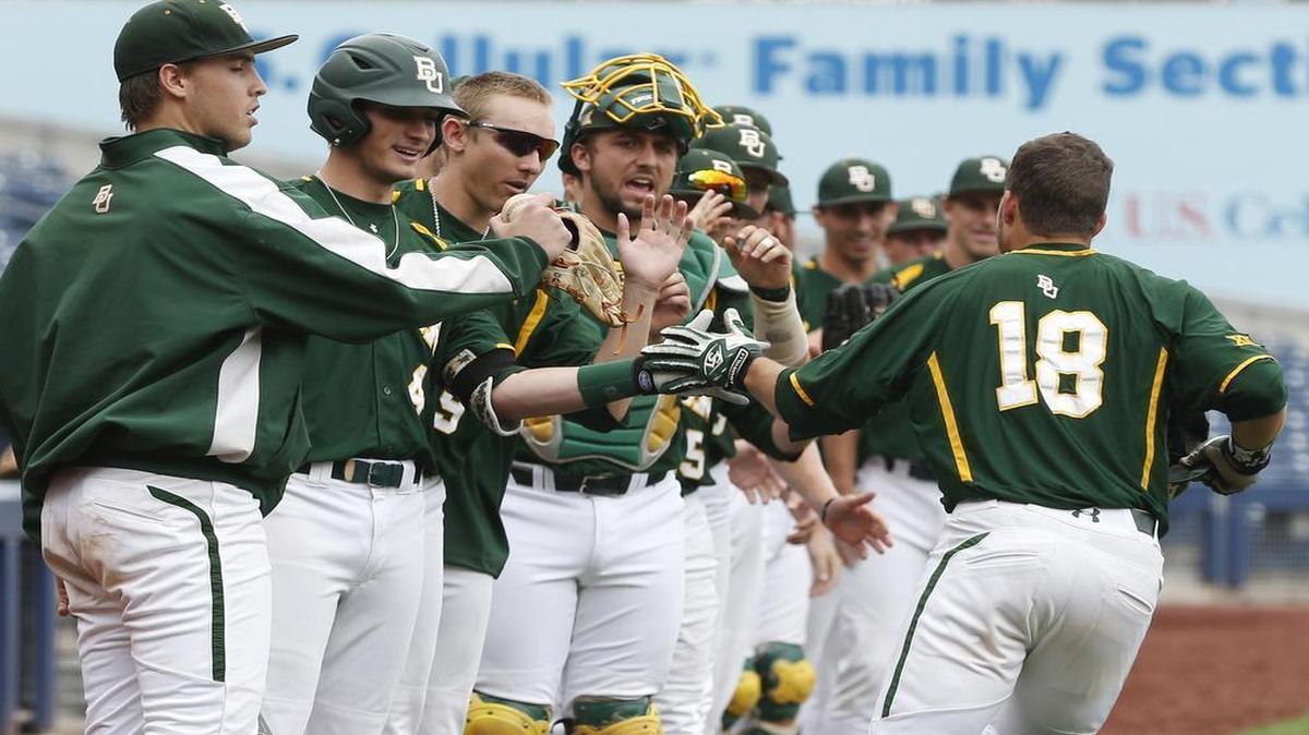 
Baylor's Kameron Esthay gets congratulations from teammates after his two-run home run in the first inning off TCU’s Alex Young during the opening round of the Big 12 tournament.
