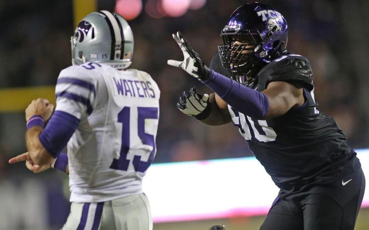 
TCU defensive tackle Terrell Lathan, chasing Kansas State quarterback Jake Waters last year, is expected to play Saturday at Kansas State.

