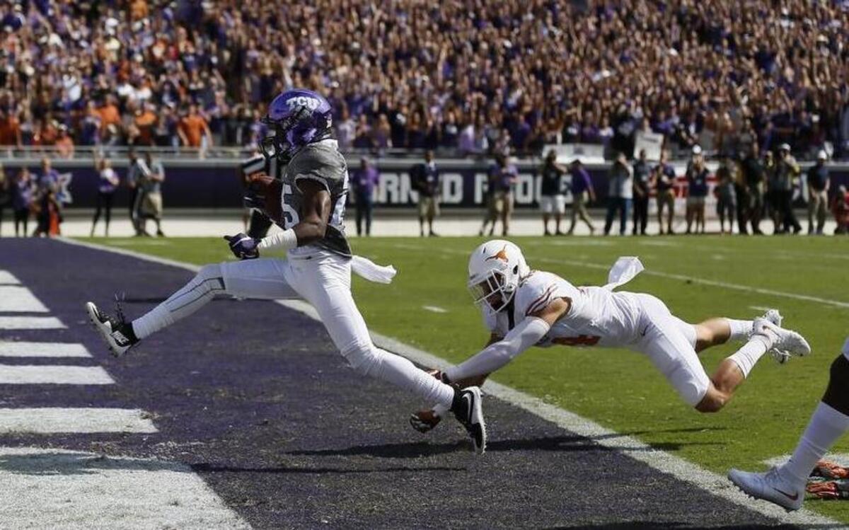 
KaVontae Turpin of TCU had six catches for 138 yards and four touchdowns against Dylan Haines and Texas.

