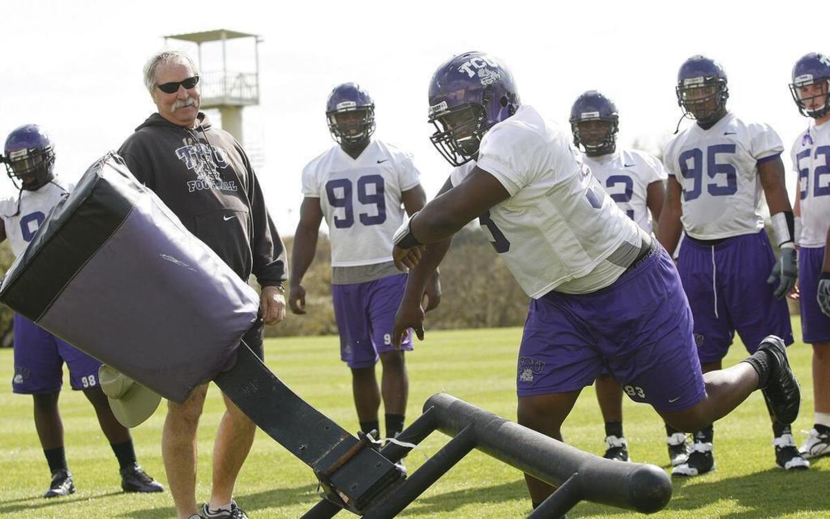 Defensive coordinator Dick Bumpas, left, coaches during a spring workout in March 2010. Bumpas is one of nine inductees into the Southwest Conference Hall of Fame after an All-American career as a player at Arkansas.