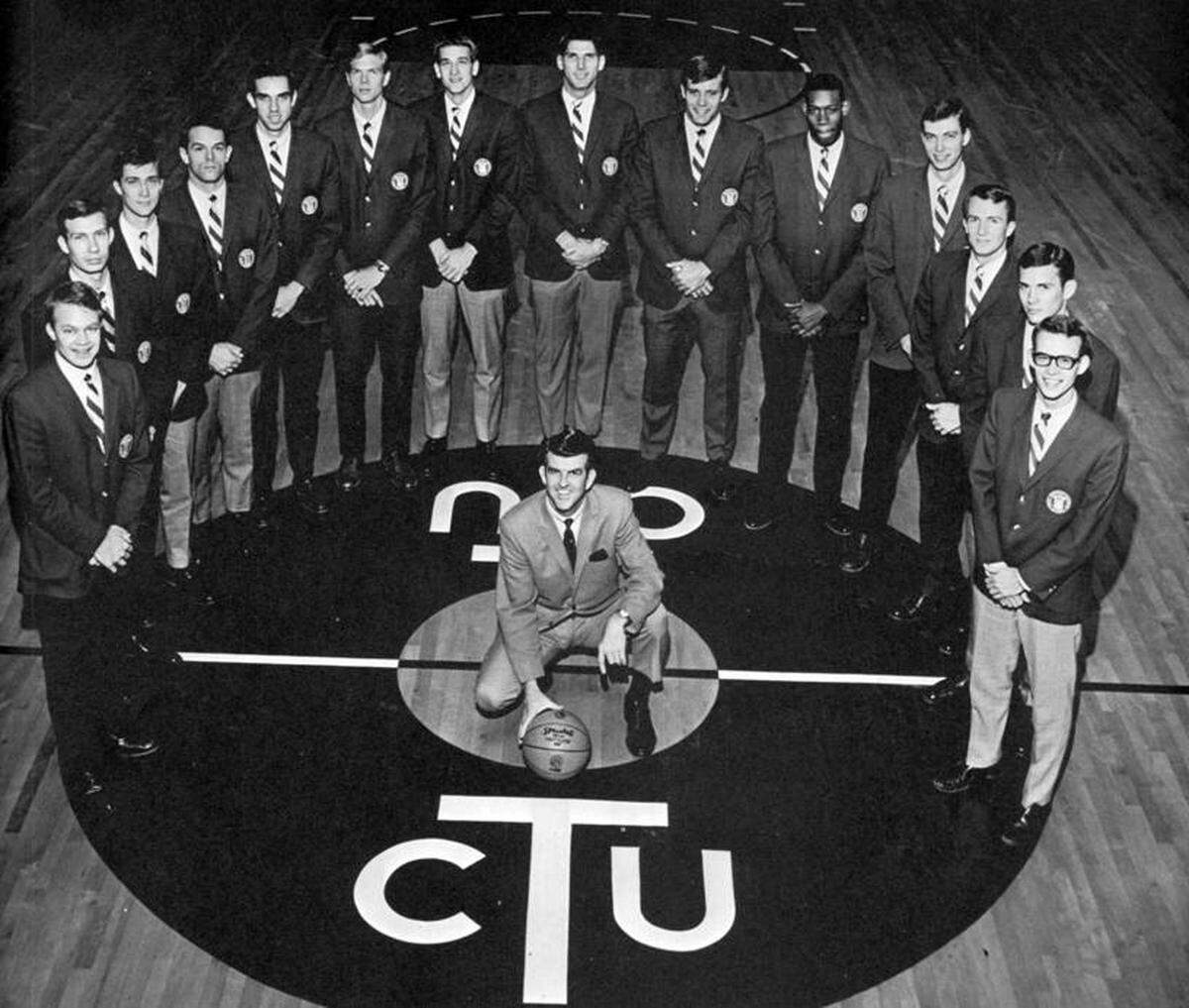 (From left to right) the 1968 TCU men’s basketball team: Rick Hosea, Tommy Gowan, Jeff Harp, Rick Wittenbraker, Tom Swift, Robert Nees, Mike Sechrist, Randy Kerth, Mickey McCarty, James Cash, Jerry Chambers, Carey Sloan, Bill Swanson and Les Bradley, with coach Johnny Swaim in the middle.