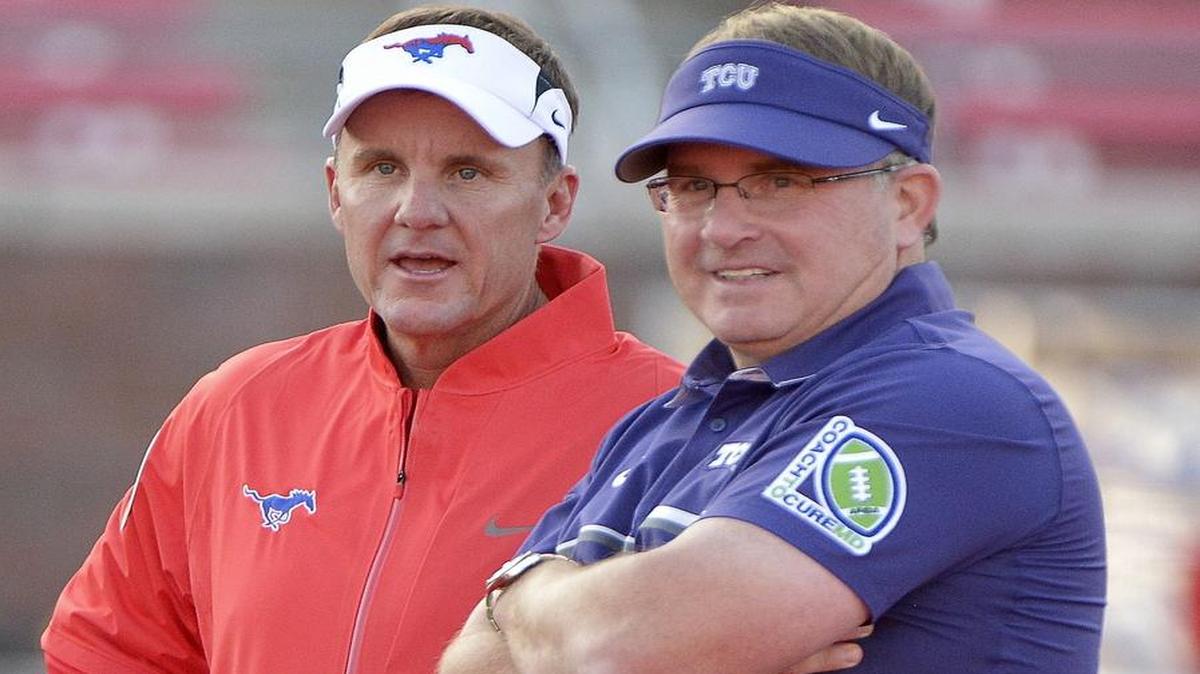 TCU coach Gary Patterson talks with SMU coach Chad Morris (left) before their Sept. 23 game in Dallas.