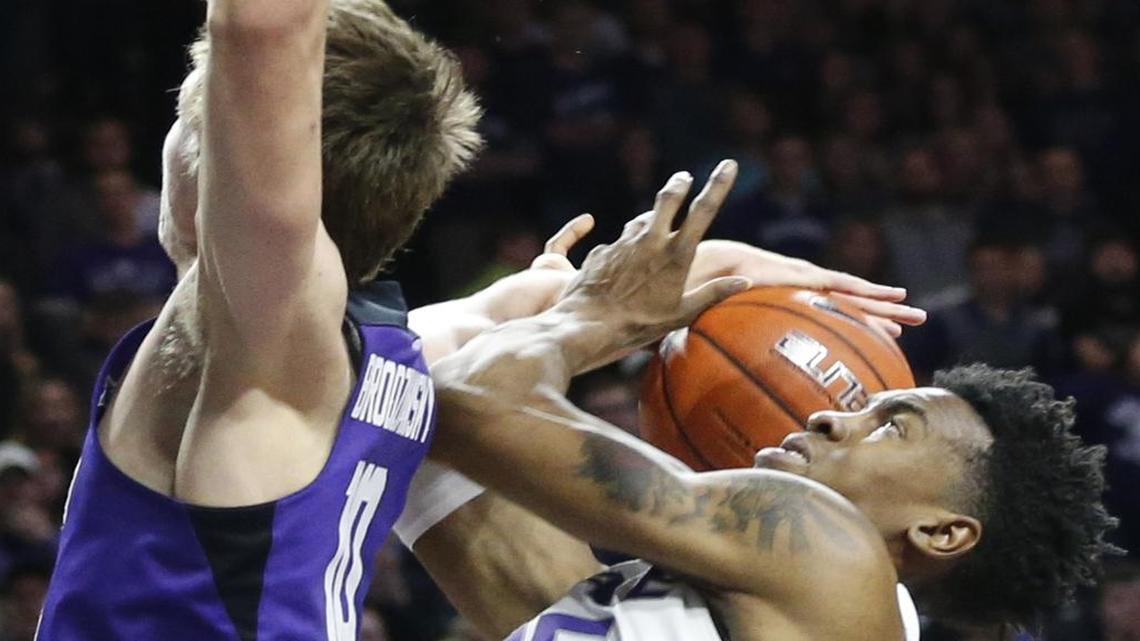 Kansas State forward Wesley Iwundu (25) is fouled by TCU forward Vladimir Brodziansky (10) under the basket in overtime of Wednesday’s game.