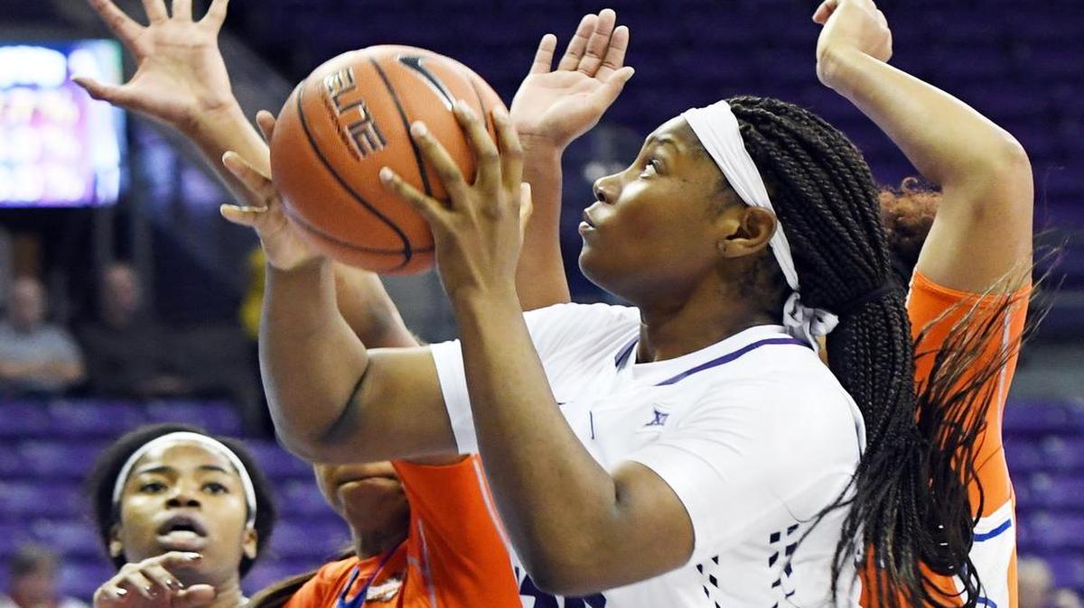 TCU’s Amy Okonkwo, front goes up for the basket as Sam Houston State’s Ashleigh Cooper, left and Angela Delaney try to defend during the third quarter of Tuesday’s game.