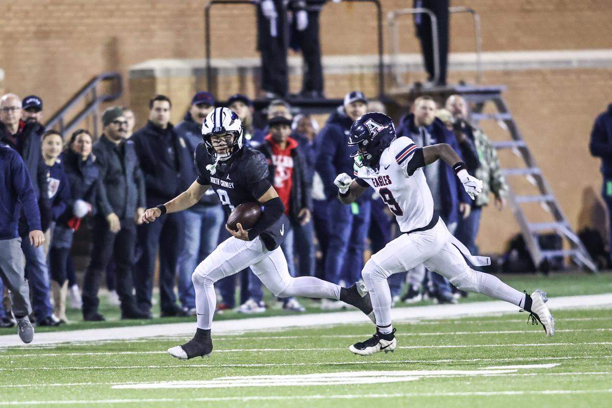 North Crowley quarterback Hayes Cloutier runs for a first down against North Crowley during the Class 6A Division I regional final Friday, Dec. 5, 2025, at DATCU Stadium in Denton.
