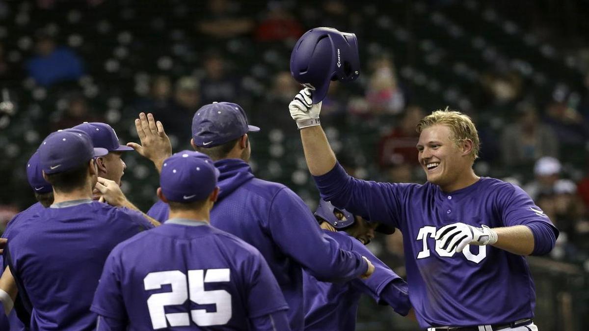 TCU freshman Luken Baker gets congratulations after hitting a home run against Rice at the Shriners College Classic on Feb. 27. He picked up the pitching victory, also, in the Horned Frogs’ 10-0 win.