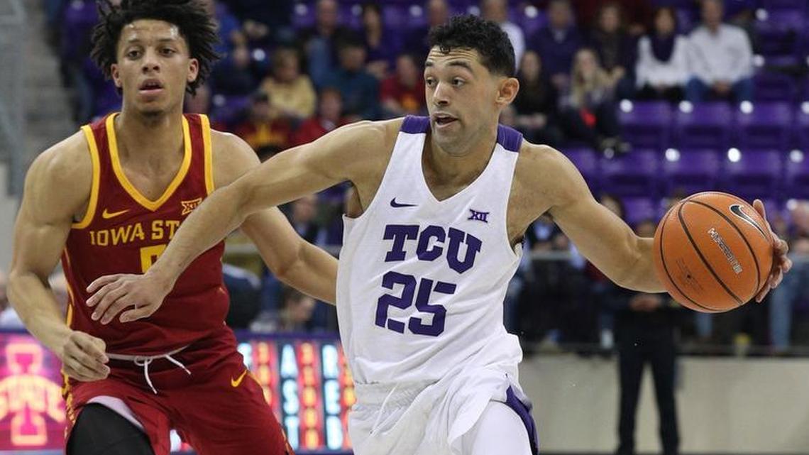 TCU Horned Frogs guard Alex Robinson (25) moves the ball past Iowa State Cyclones guard Lindell Wigginton in a recent game.