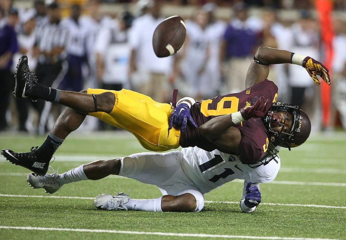 Minnesota wide receiver Eric Carter misses a grab as he was defended by TCU cornerback Ranthony Texada.