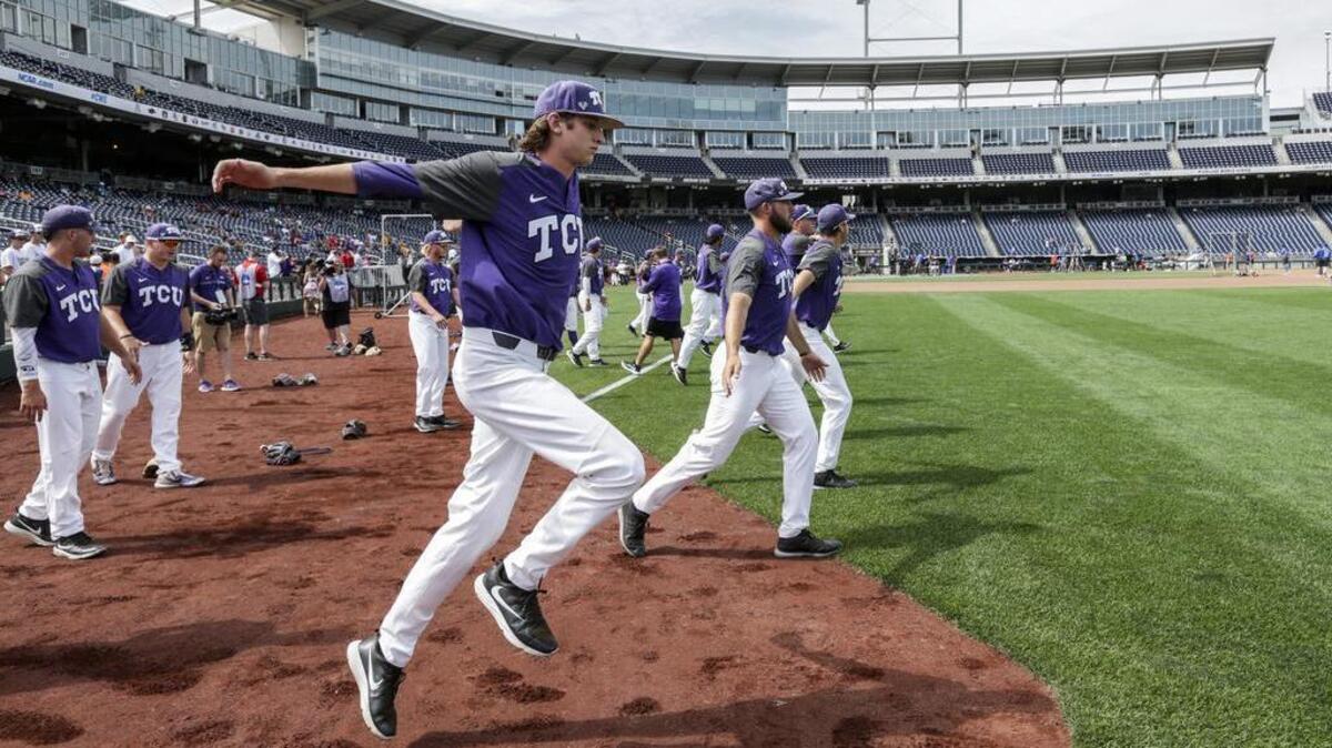 TCU pitchers Nick Lodolo (center) and Mitchell Traver stretch as they lead warmups at TD Ameritrade Park on Friday.
