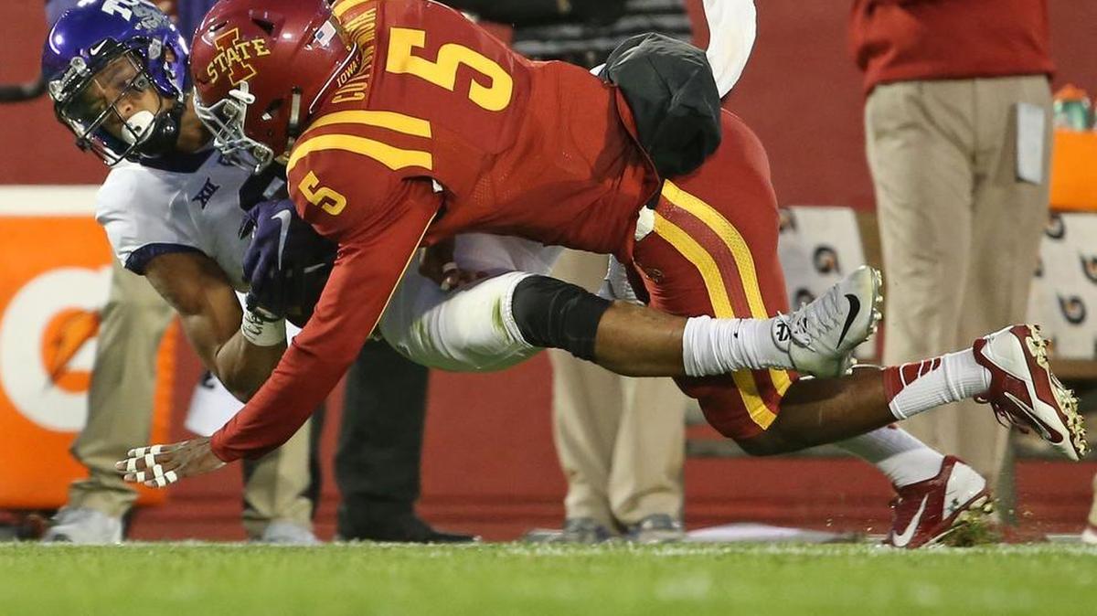 
TCU receiver Josh Doctson goes to the ground with a catch after a hit by Iowa State defensive back Kamari Cotton-Moya. Doctson, who said he got the wind knocked out of him on the play and hurt his hip, returned to the game and finished with 10 catches for 190 yards and two touchdowns.
