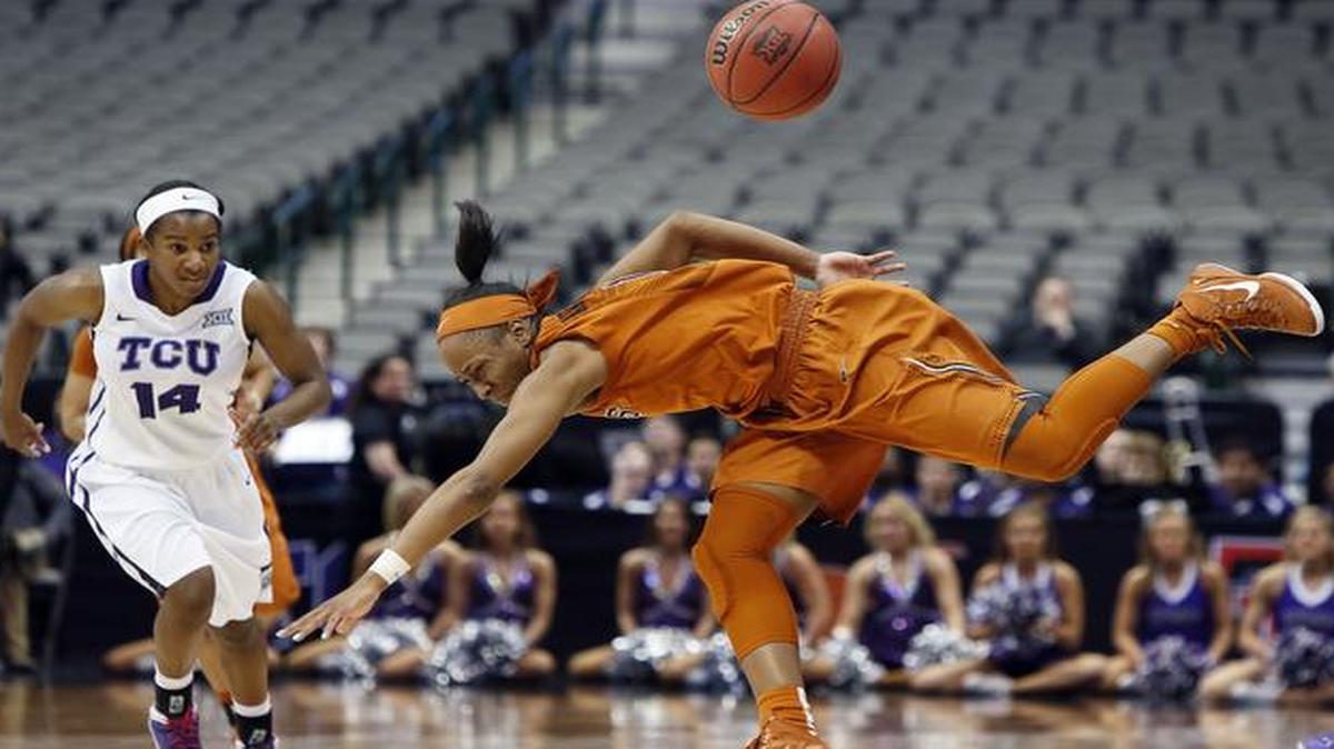 
TCU guard Zahna Medley (14) looks on as Texas guard Empress Davenport (1) loses control of the ball during the second half of an NCAA college basketball game in the quarterfinals of the Big 12 Conference tournament, Saturday, March 7, 2015, in Dallas. 
