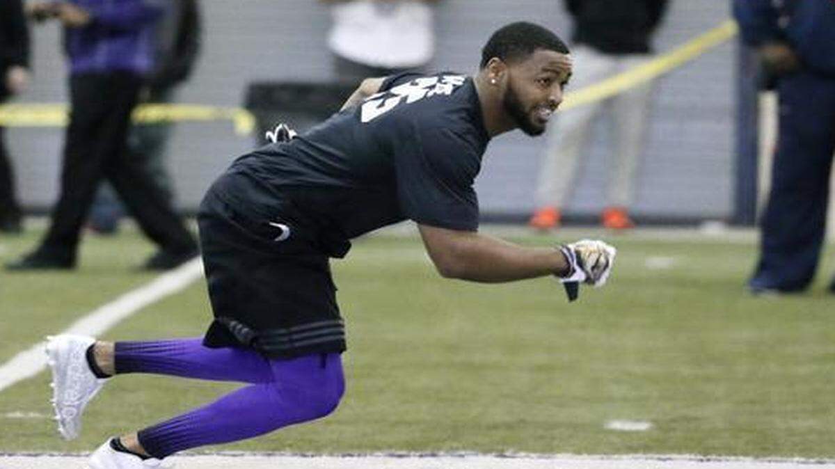 
Cornerback Kevin White runs a drill as he works out for scouts and coaches at TCU’s Pro Day on Friday in familar surroundings at the Sam Baugh Indoor Facility.
