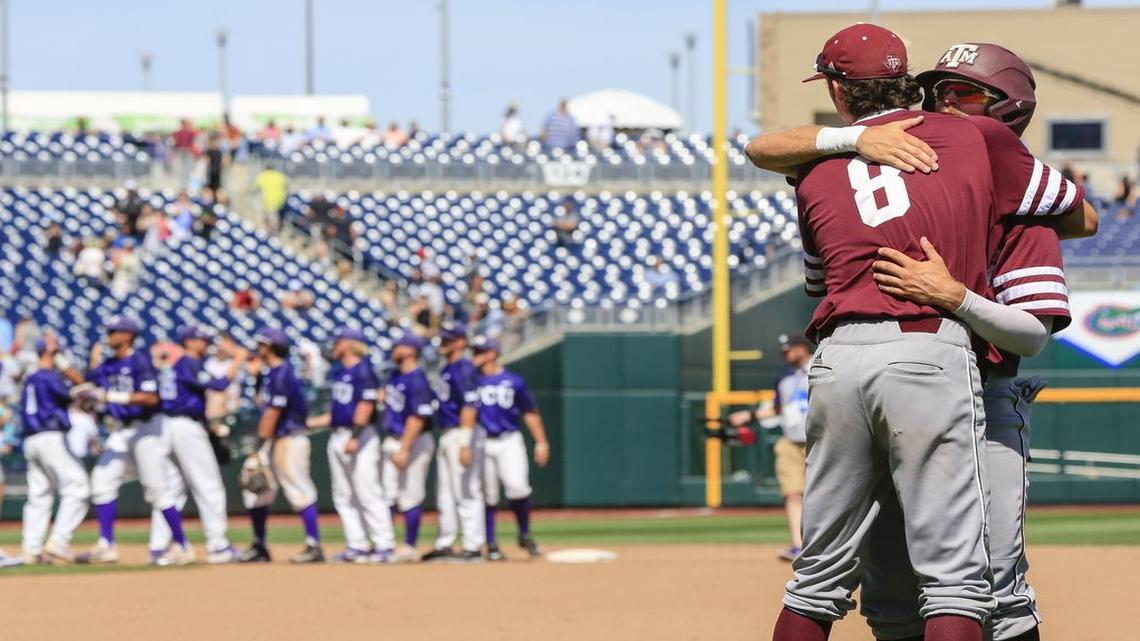 Texas A&M’s Braden Shewmake (8) and Blake Kopetsky embrace following a 4-1 loss to TCU in an elimination game Tuesday at the College World Series.