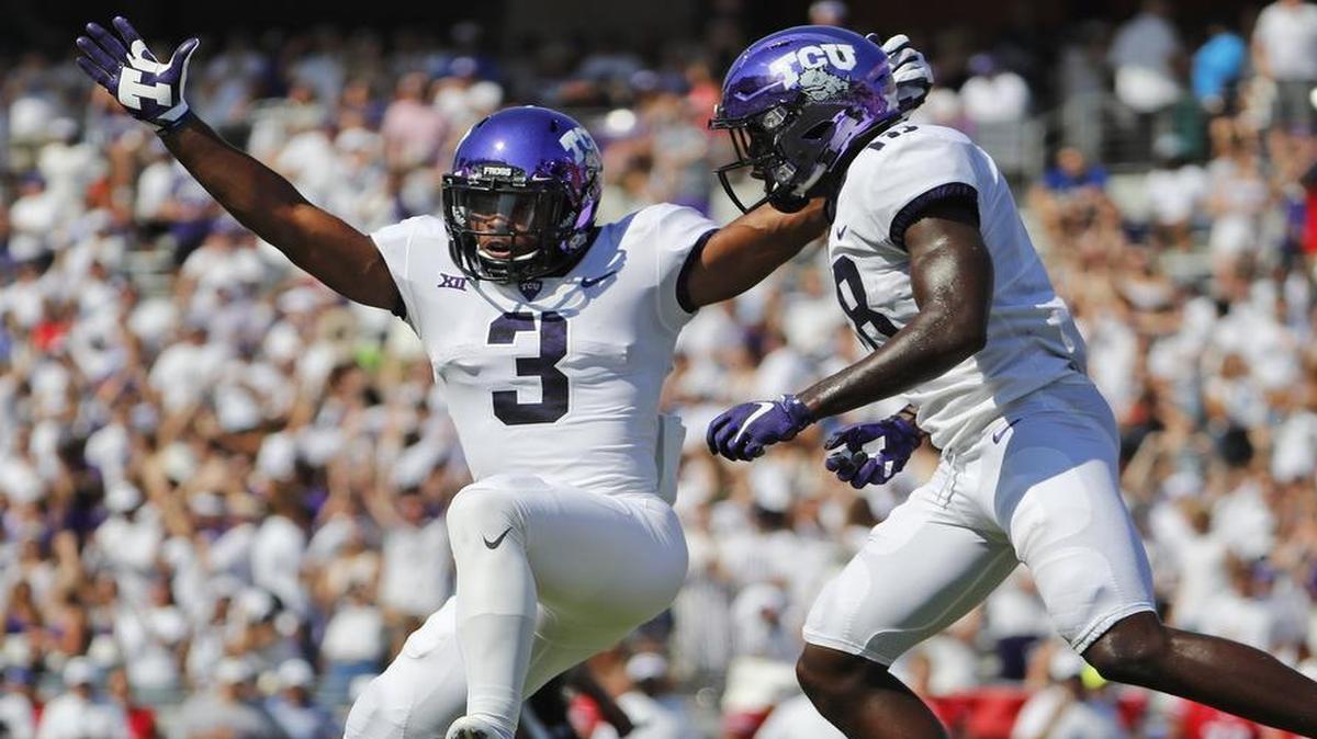 TCU receivers Shaun Nixon (3) and Jalen Reagor celebrate Nixon’s second-quarter touchdown catch against SMU Saturday at Amon G. Carter Stadium in Fort Worth. TCU won 56-36.