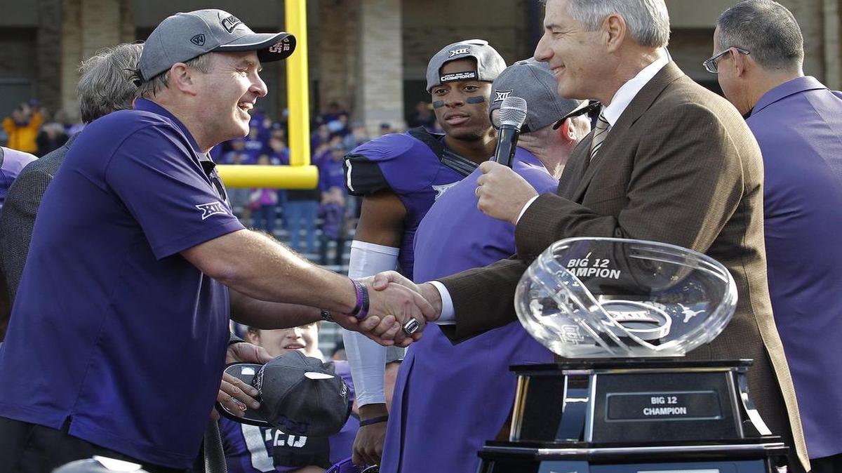 
Big 12 commissioner Bob Bowlsby shakes the hand of TCU coach Gary Patterson after a 55-3 victory against Iowa State clinched a share of the conference title for the Horned Frogs. Bowlsby said at the Big 12 meetings Tuesday that the conference ADs are taking a thoughtful approach to a conference championship game.
