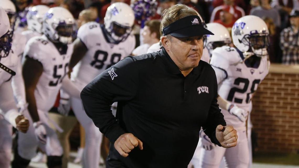 TCU coach Gary Patterson leads the Horned Frogs onto the field for the start of Saturday night’s game at Oklahoma.