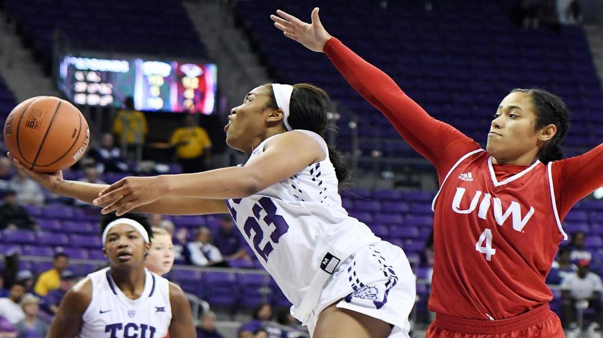 TCU’s AJ Alix, left, stretches out against Incarnate Word’s Tangunique Ajeto for the basket during the second quarter of Friday’s November 11, 2016 basketball game at Schollmaier Arena, in Fort Worth, Texas.