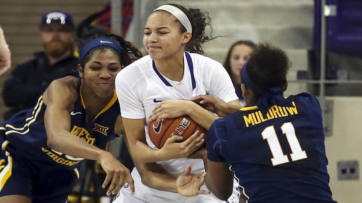TCU #25 Kianna Ray fights West Virginia #11 Teana Muldrow for a loose ball in a womens basketball game at Schollmaier Arena at TCU Thursday, December 29, 2016.