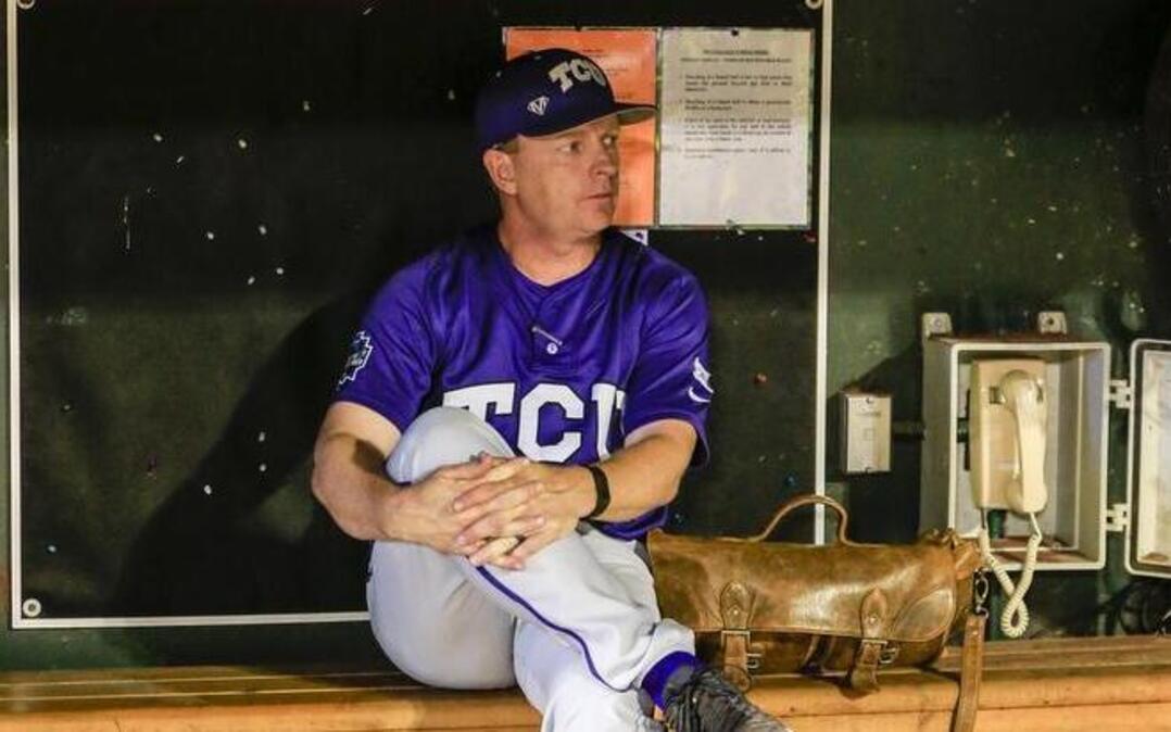 TCU coach Jim Schlossnagle sits in the dugout following the end of a 7-5 loss to Coastal Carolina at the College World Series. The June 25 loss in Omaha was the Horned Frogs’ second in two nights to the Chanticleers, who advanced to the championship series with the victory.