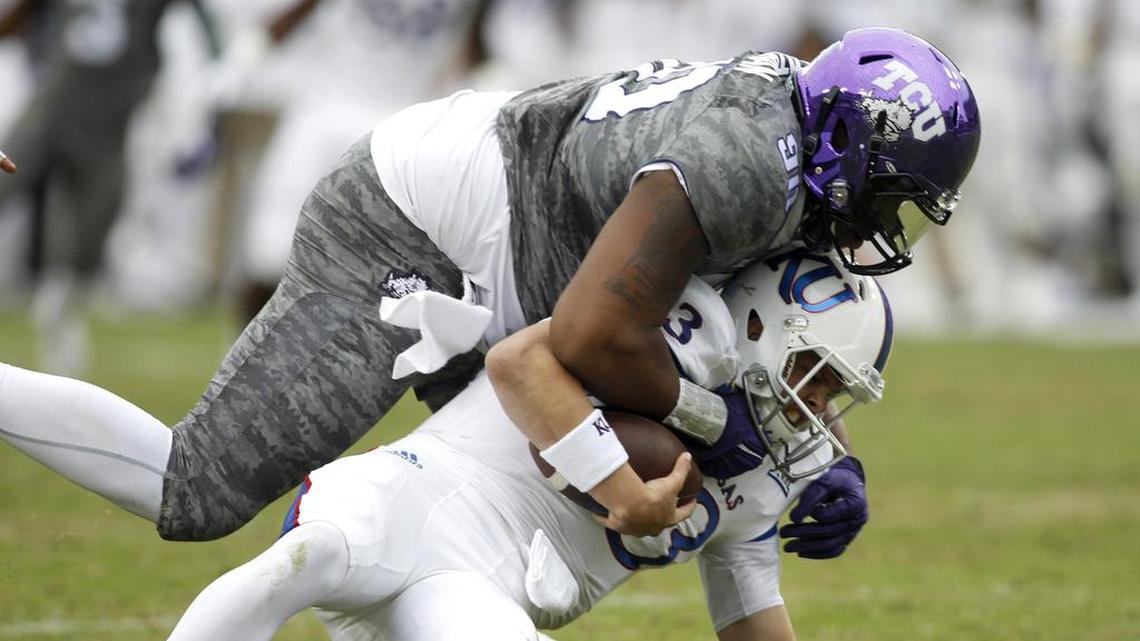 TCU defensive end Terrell Lathan sacks Kansas Jayhawks quarterback Ryan Willis in a 23-17 win in November 2015.