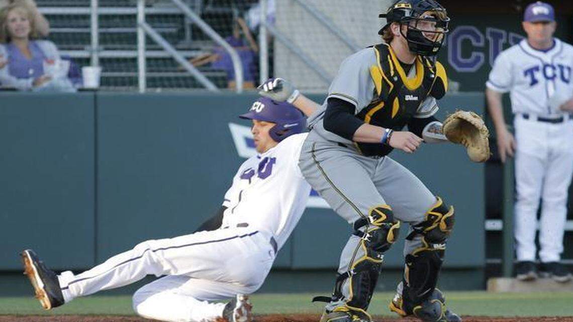 
 TCU’s Dane Steinhagen scores while Wichita State catcher Gunnar Troutwine waits on a late throw in the first inning Friday. 
