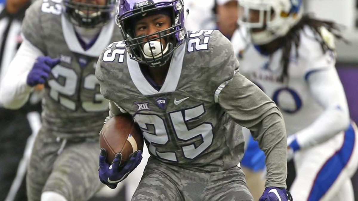 TCU receiver KaVontae Turpin makes a cut on the way to a 49-yard punt return for a touchdown, giving the Horned Frogs their first points Saturday against Kansas. It was the first special-teams return for a touchdown by TCU this season.