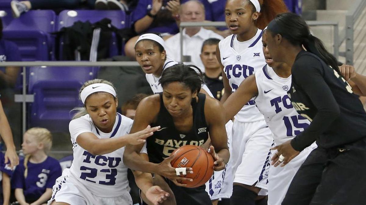 TCU guard AJ Alix (23) battles for a rebound with Baylor forward Khadijiah Cave (55) at Schollmaier Arena.