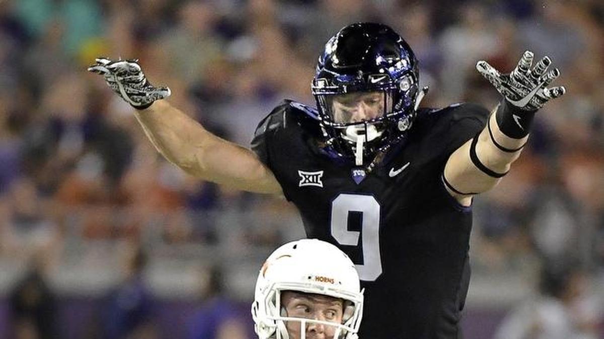 TCU defensive end Mat Boesen puts pressure on Texas quarterback Shane Buechele during a game at Amon G. Carter Stadium in Fort Worth in November.