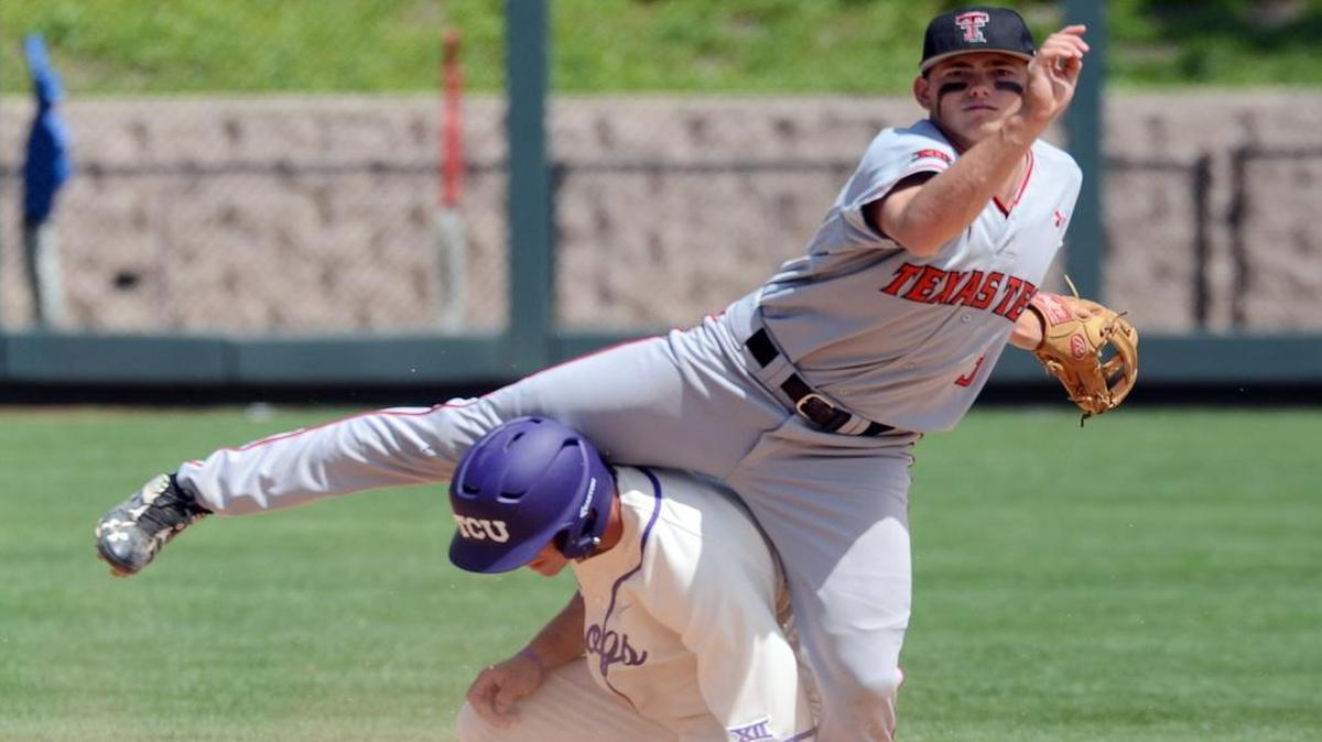 TCU’s Josh Watson, left, is caught underneath the leg of Texas Tech second baseman Michael Davis as he is forced out in a double play in the sixth inning.
