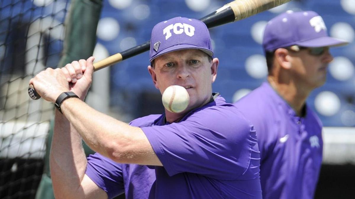 TCU coach Jim Schlossnagle hits balls with a fungo bat during fielding practice on June 17 at TD Ameritrade Park, where the Horned Frogs were preparing for their third consecutive College World Series competition. Schlossnagle signed a contract extension Monday, according to a tweet from athletic director Chris Del Conte.