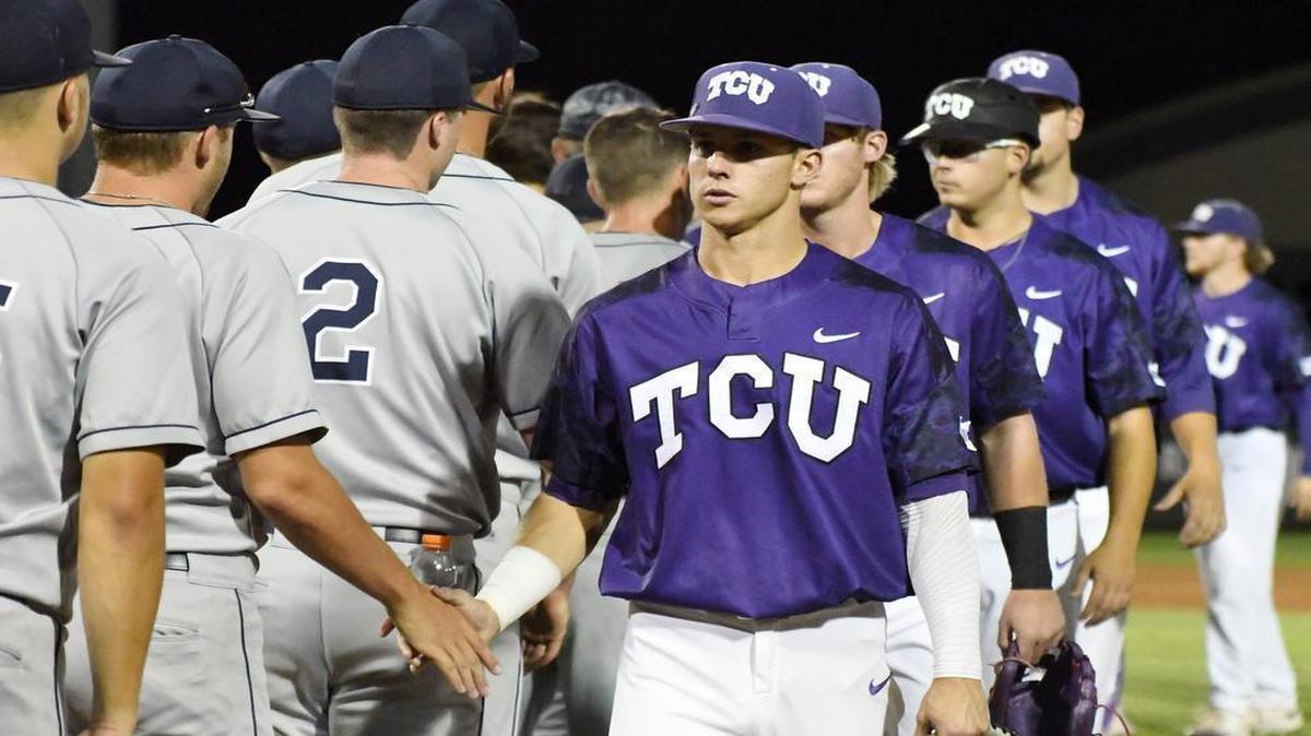 TCU center fielder Nolan Brown leads the handshake line with Dallas Baptist after the Horned Frogs’ victory in the Fort Worth Regional championship game Monday night at Lupton Stadium.