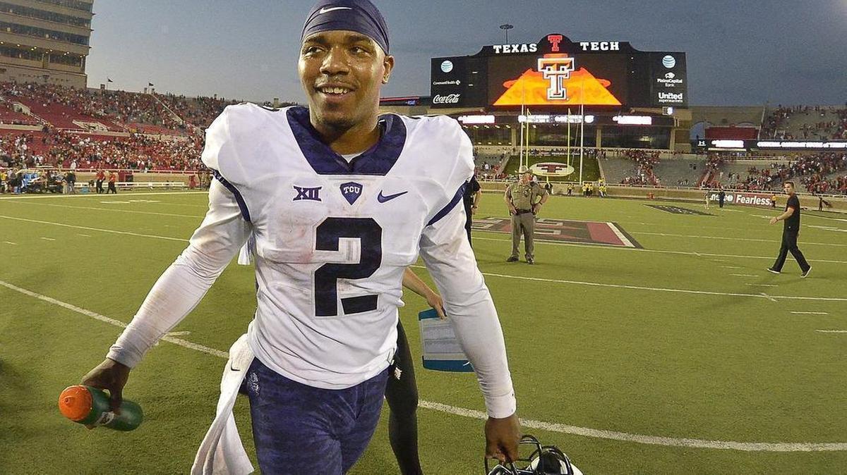 
TCU quarterback Trevone Boykin heads to the locker room with a smile after the celebration on the field following a 55-52 victory at Texas Tech. That made Boykin 6-1 on the road since becoming the full-time starter last year.
