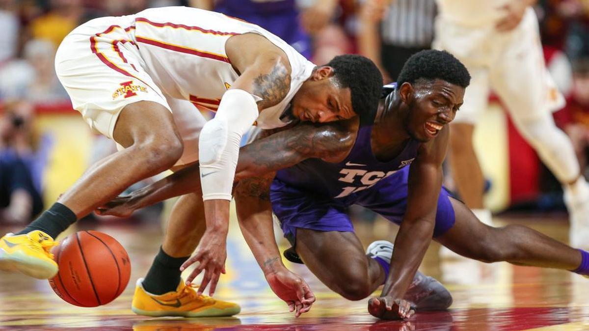 Iowa State forward Darrell Bowie and TCU forward JD Miller fight for control of the ball during the first half of an NCAA college basketball game, Saturday, Feb. 18, 2017, in Ames, Iowa.
