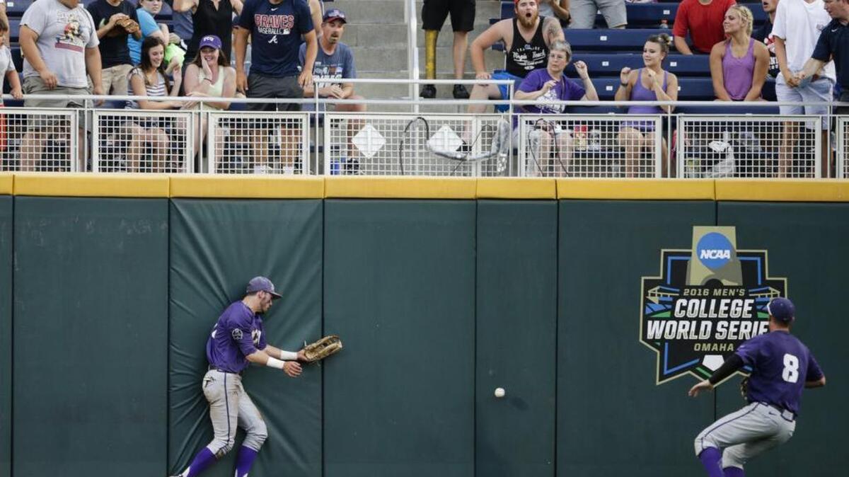 TCU center fielder Dane Steinhagen, left, and right fielder Austen Wade chase a two-run triple by Coastal Carolina’s G.K. Young.