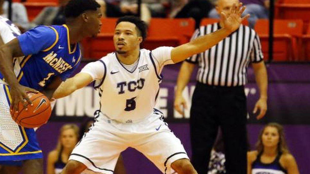 
TCU Horned Frogs guard Kyan Anderson  guards McNeese State Cowboys guard Jamaya Burr  during a game at Wilkerson-Greines Activity Center. 
