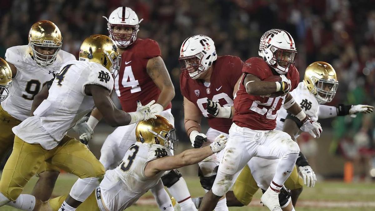 Stanford running back Bryce Love breaks through the line for a first down against Notre Dame on Nov. 25. Love is second in the nation with 1,973 yards rushing.