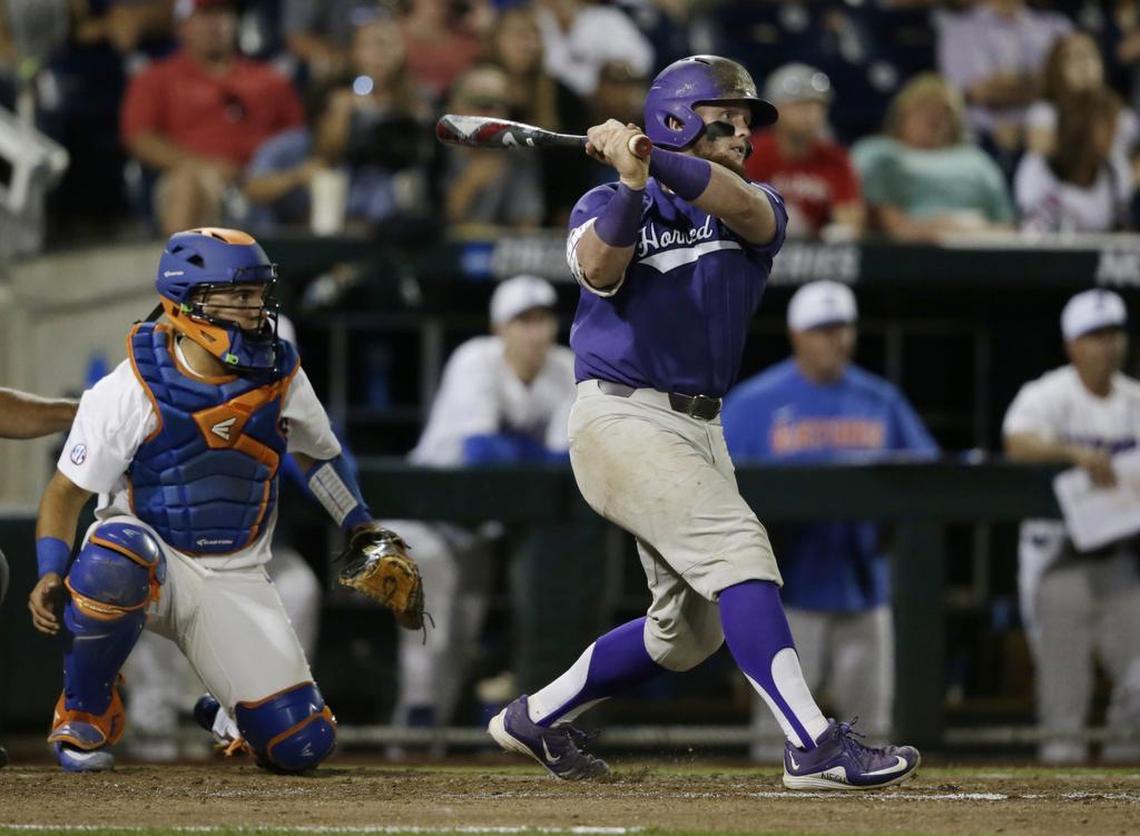 TCU catcher Evan Skoug follows through on his swing on a three-run double in the sixth inning that broke open the Horned Frogs’ 9-2 victory against Florida in the College World Series semifinals.