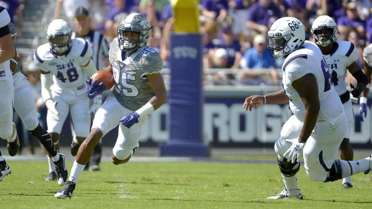TCU’s KaVontae Turpin cuts upfield on a punt return against Stephen F. Austin in a Sept. 12 game at Amon G. Carter Stadium.
