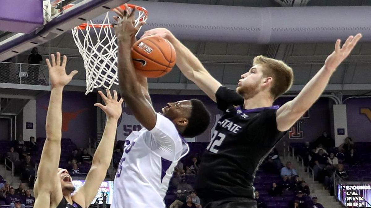 TCU forward JD Miller, center, has his shot rejected by Kansas State forward Dean Wade during the first half Wednesday.
