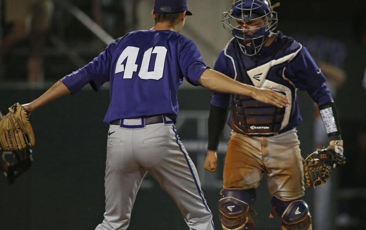 
Trey Teakell greets catcher Kyle Bacak at the plate after a relay throw prevented the winning run from scoring for Sam Houston State in the 13th inning of what became a 22-inning victory for TCU in the regional tournament last year. Teakell threw 6.1 innings as part of a six-reliever effort.
