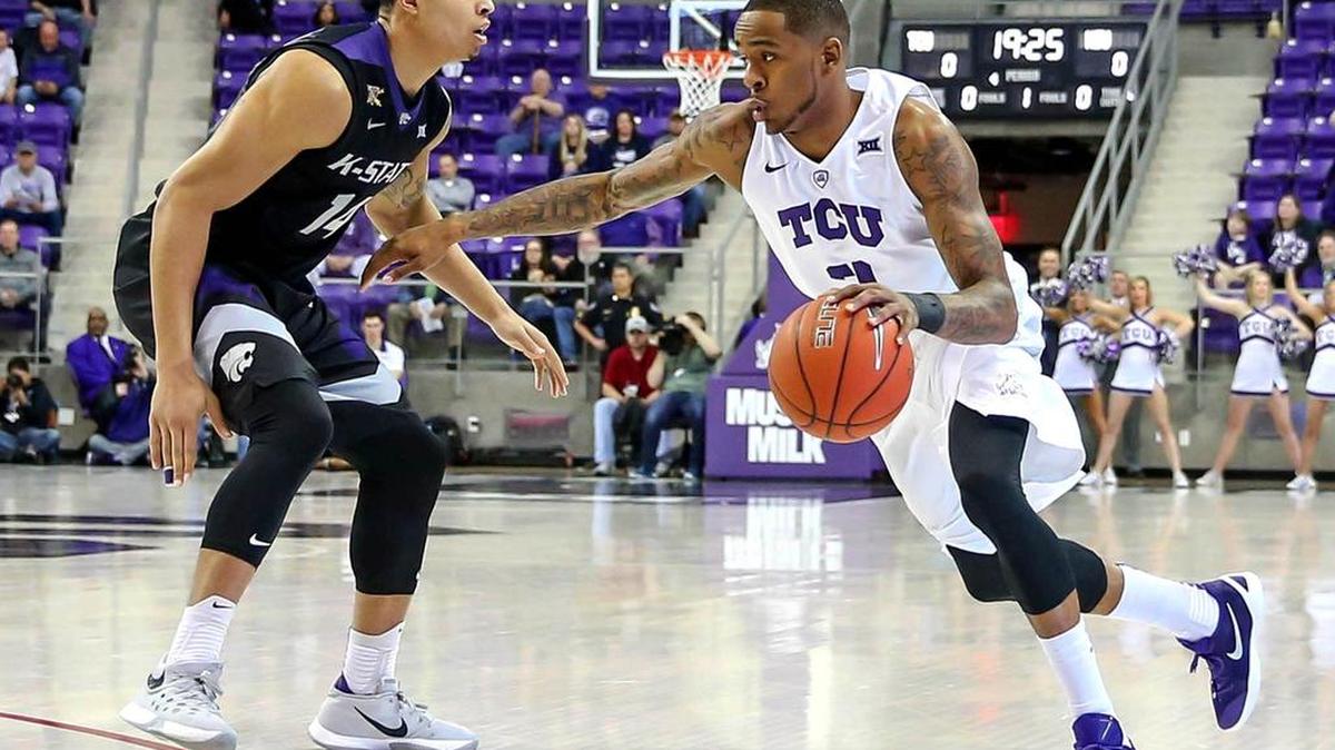 TCU guard Malique Trent, driving against the defense of Kansas State guard Justin Edwards in a Feb. 16 game, averaged 20 points last week against Texas Tech and Baylor to earn Big 12 newcomer of the week honors.